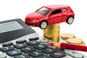 car and calculator. rising costs for car purchase, lease, worksh